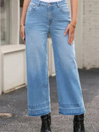 Women’s high-waisted wide-leg washed denim jeans with a relaxed fit, from Trendsi, shown on a model.