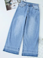 Women’s high-waisted wide-leg washed denim jeans with a relaxed fit, featuring classic style and trendy denim look.