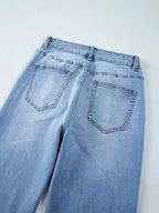Women's high-waisted wide-leg washed denim jeans with a classic relaxed fit, featuring a stylish, casual look.