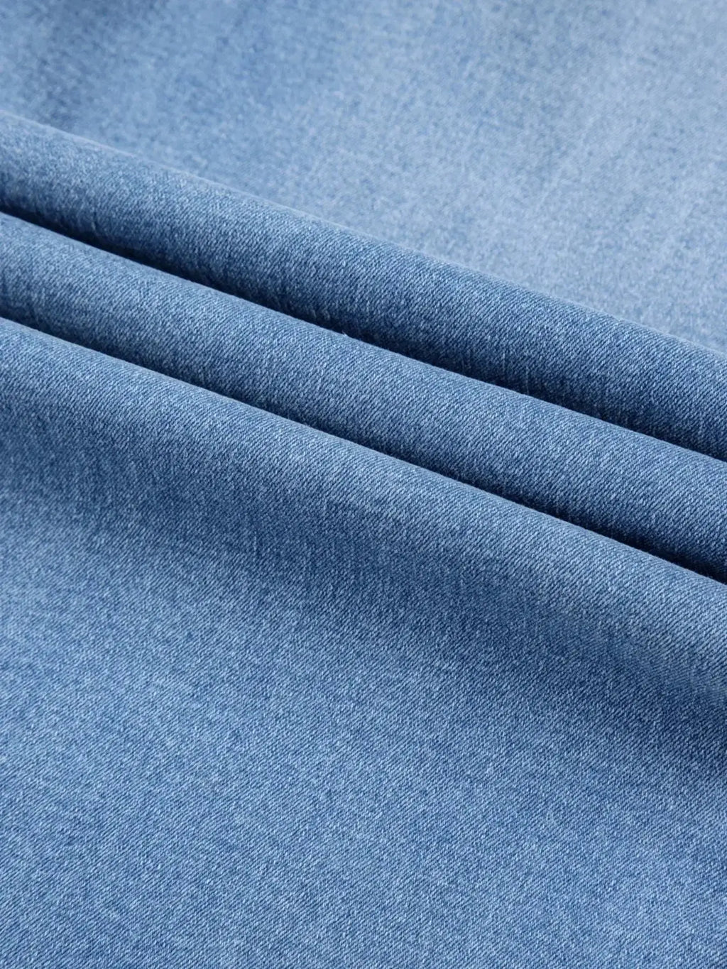 Women’s high-waisted wide-leg washed denim jeans with a relaxed fit, featuring classic denim styling and trendy design.