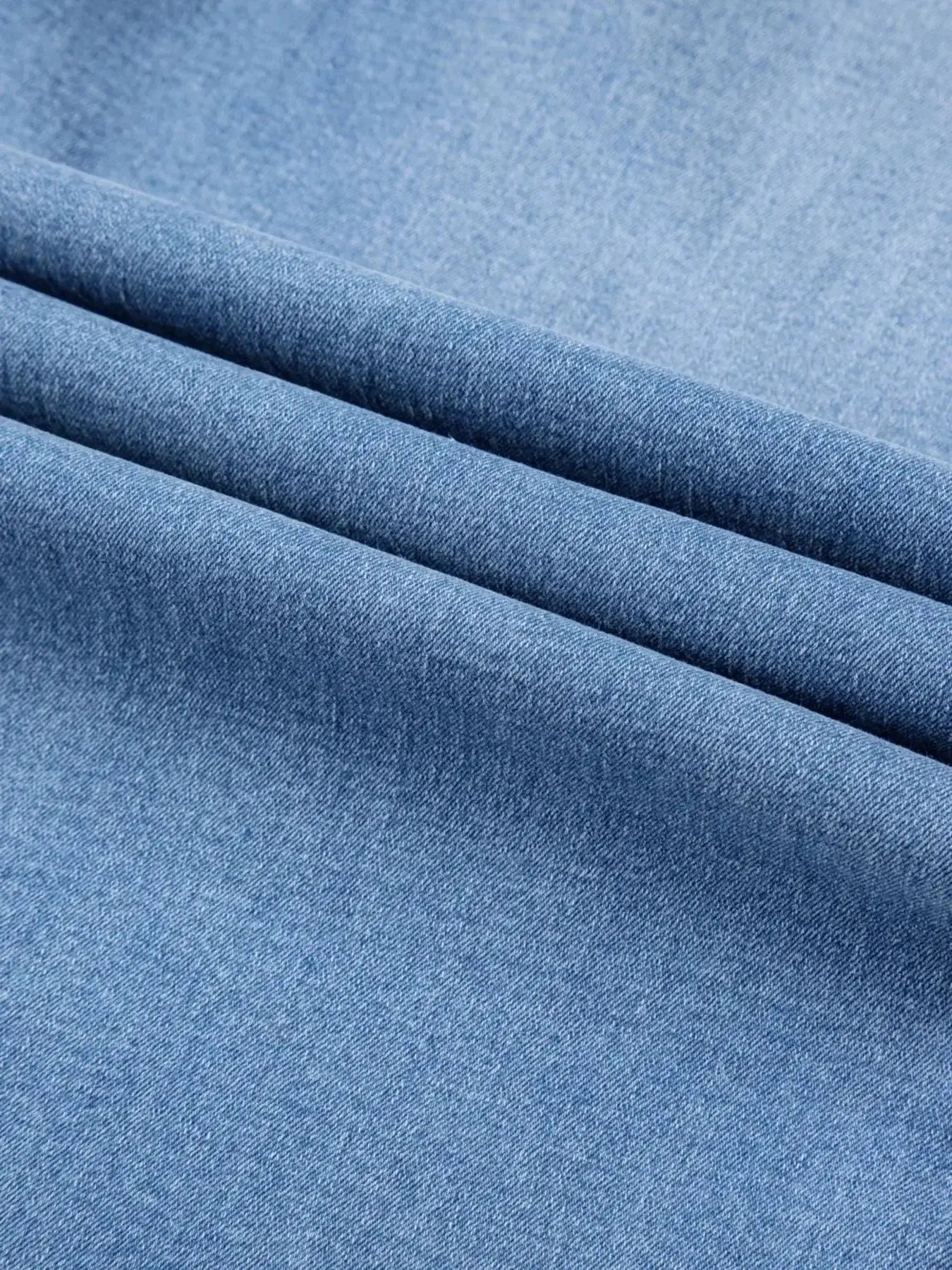 Women’s high-waisted wide-leg washed denim jeans with a relaxed fit, featuring classic denim styling and trendy design.