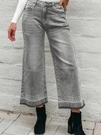 Women’s high-waisted wide-leg washed denim jeans with a relaxed fit, styled casually, by Trendsi.