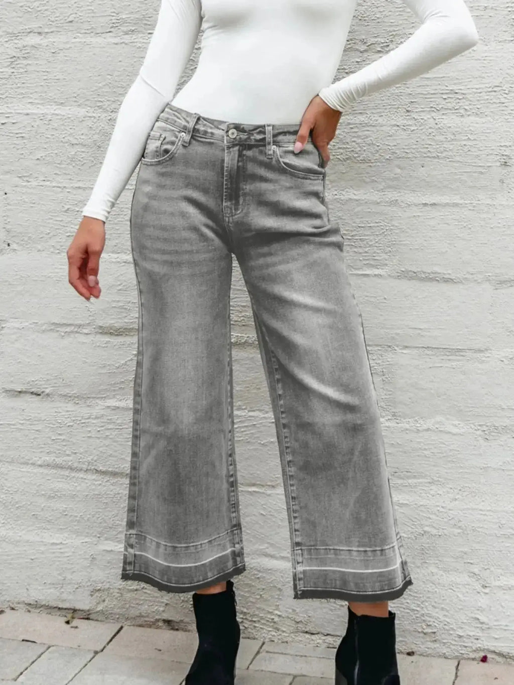 Women's high-waisted wide-leg washed denim jeans with a relaxed fit, featuring classic styling and trendy denim texture.