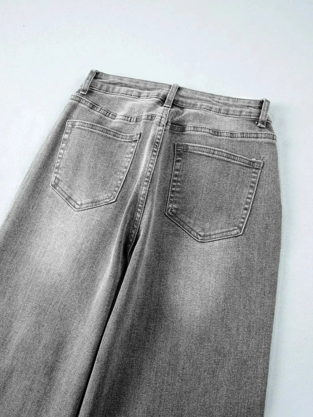 Women’s high-waisted wide-leg washed denim jeans with a classic relaxed fit, featuring a trendy and comfortable style.