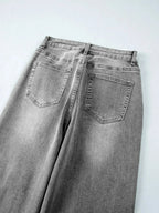Women’s high-waisted wide-leg washed denim jeans with a classic relaxed fit, featuring a trendy and comfortable style.