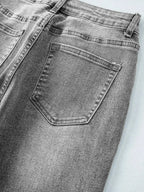Women’s high-waisted wide-leg washed denim jeans with a relaxed fit, featuring classic styling and trendy design.