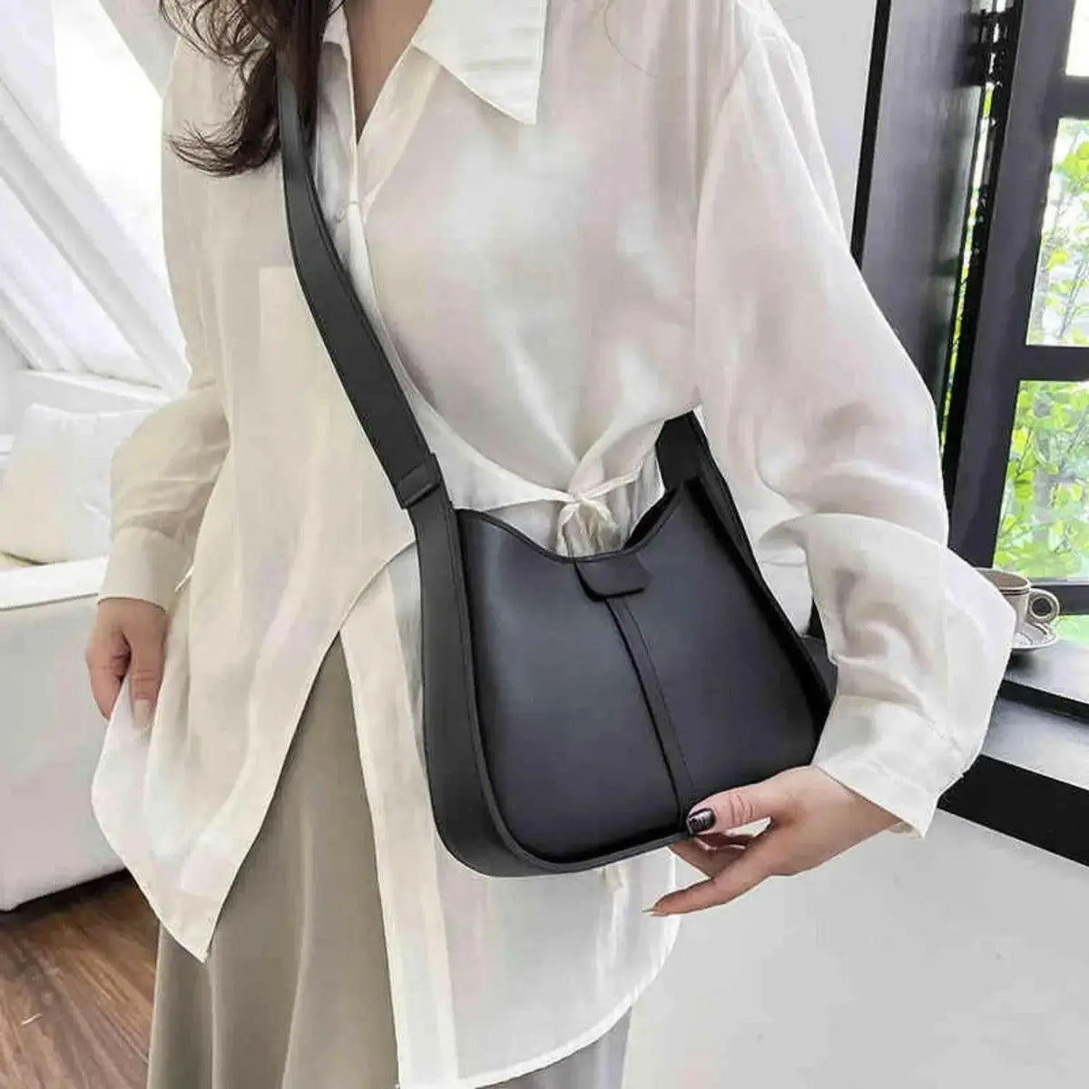 Women’s textured vegan leather crossbody handbag with versatile shoulder strap from Plush Fashion Hub, stylish and high-end design.