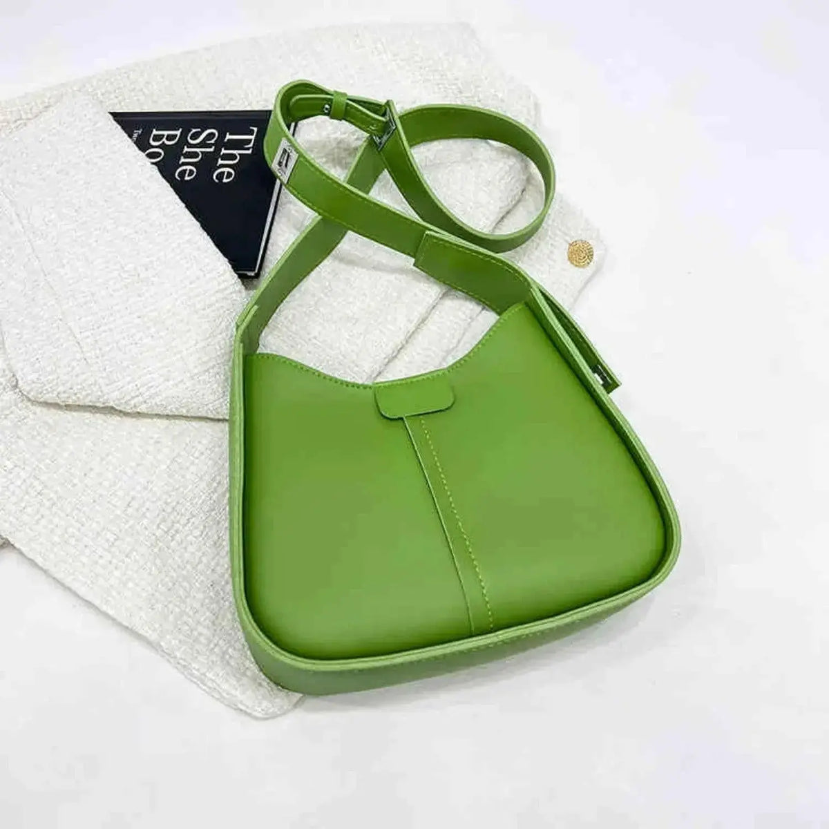 Women’s textured vegan leather crossbody handbag with versatile shoulder strap from Plush Fashion Hub, featuring a high-end design.
