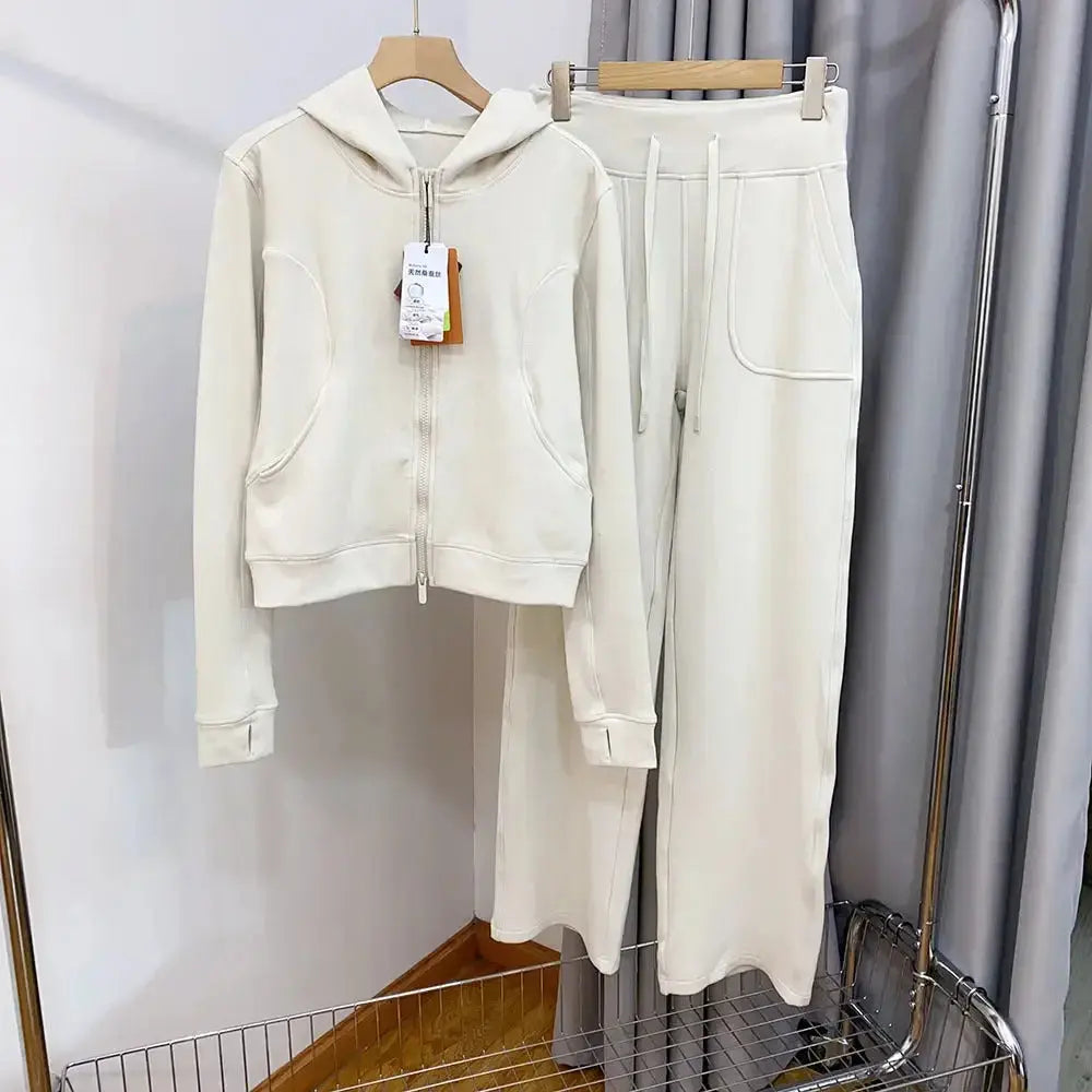Women’s hooded sweatshirt and wide-leg pants lounge set by Plush Fashion Hub, featuring a cozy hooded top and relaxed-fit pants.