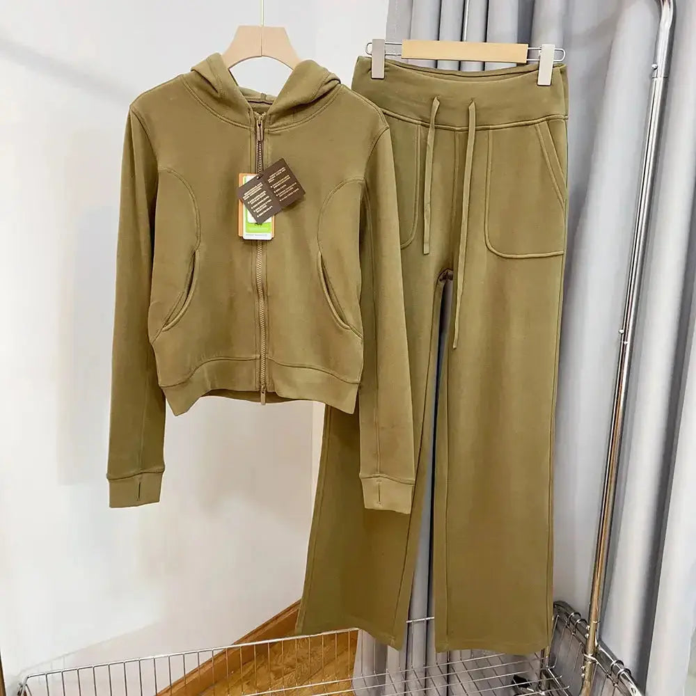 Women wearing a plush hooded sweatshirt and wide-leg pants lounge set from Plush Fashion Hub, casual and comfortable activewear.