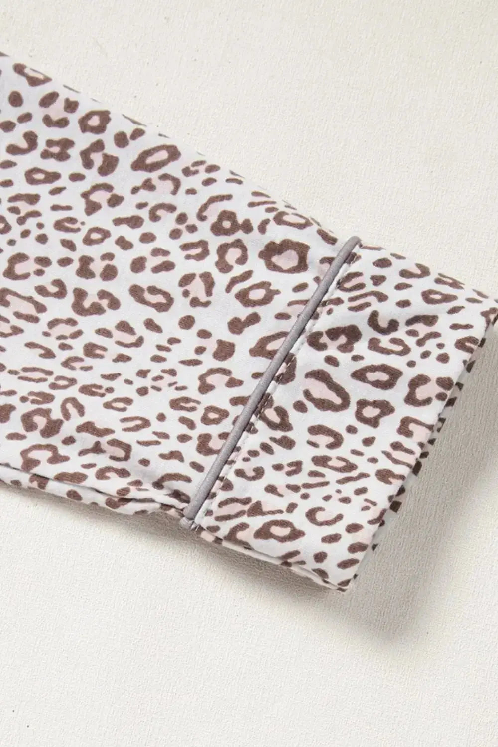 Women's leopard print long sleeve button-down pajama lounge set by Plush Fashion Hub, featuring cozy fabric and stylish design.