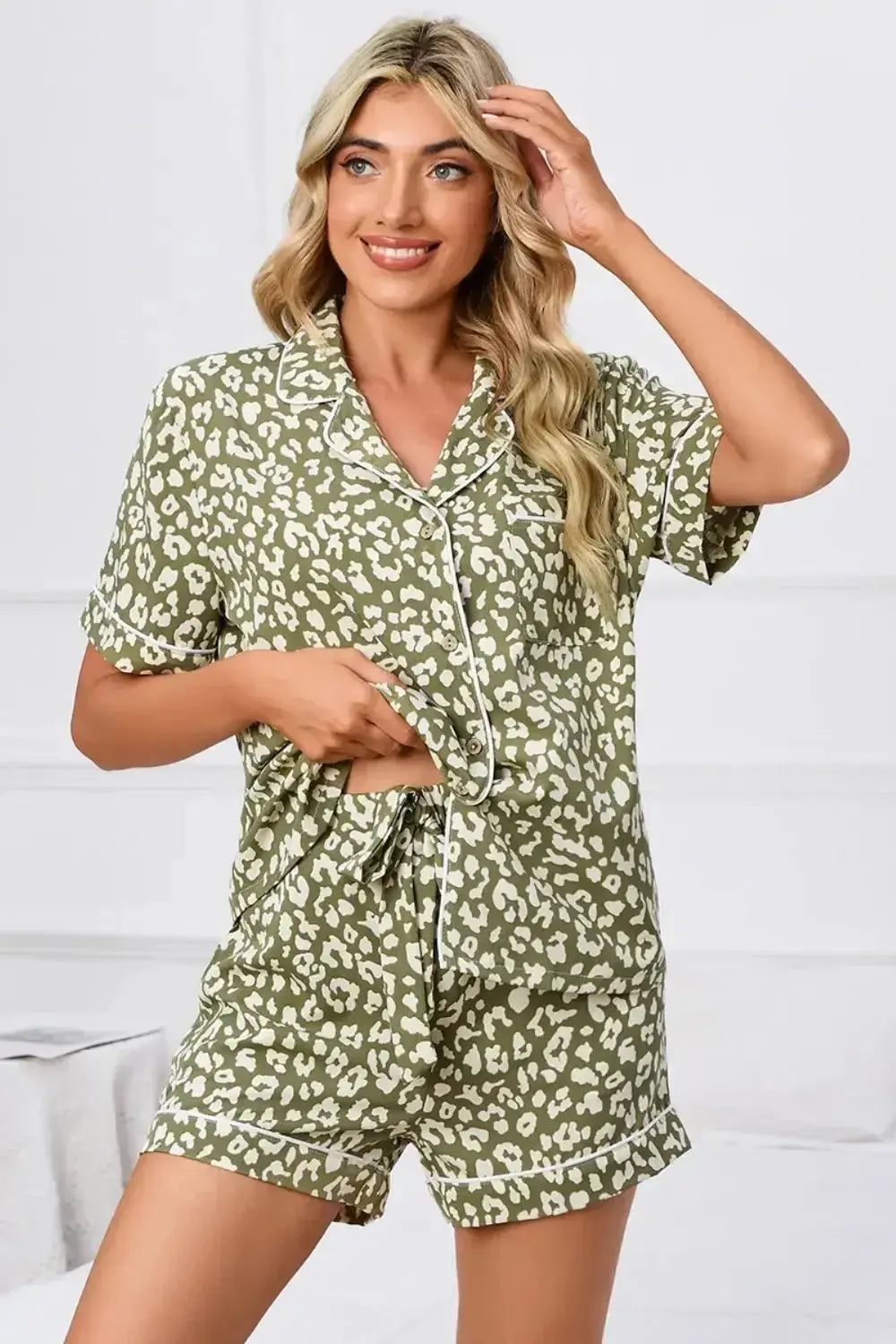 Women’s leopard print short sleeve pajama lounge set by Plush Fashion Hub, featuring button-down top and comfortable shorts.