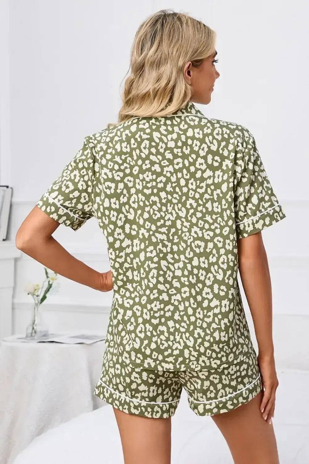 Women’s leopard print button-down short sleeve pajama lounge set by Plush Fashion Hub, featuring a stylish and comfortable pajama top and shorts.