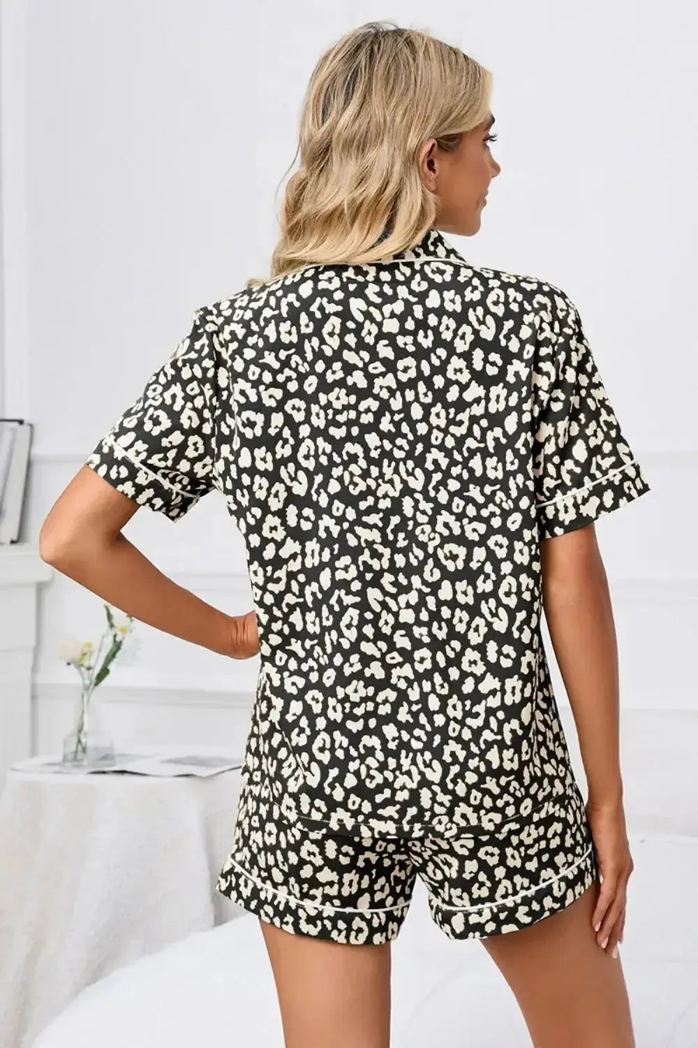 Women’s leopard print short sleeve pajama lounge set by Plush Fashion Hub, featuring button-down top and matching shorts.
