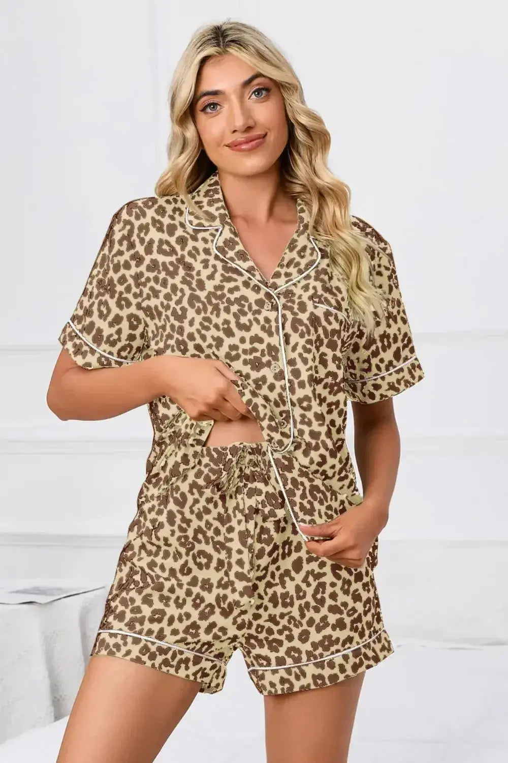 Women’s leopard print button-down short sleeve pajama lounge set by Plush Fashion Hub, featuring relaxed fit and stylish pattern.
