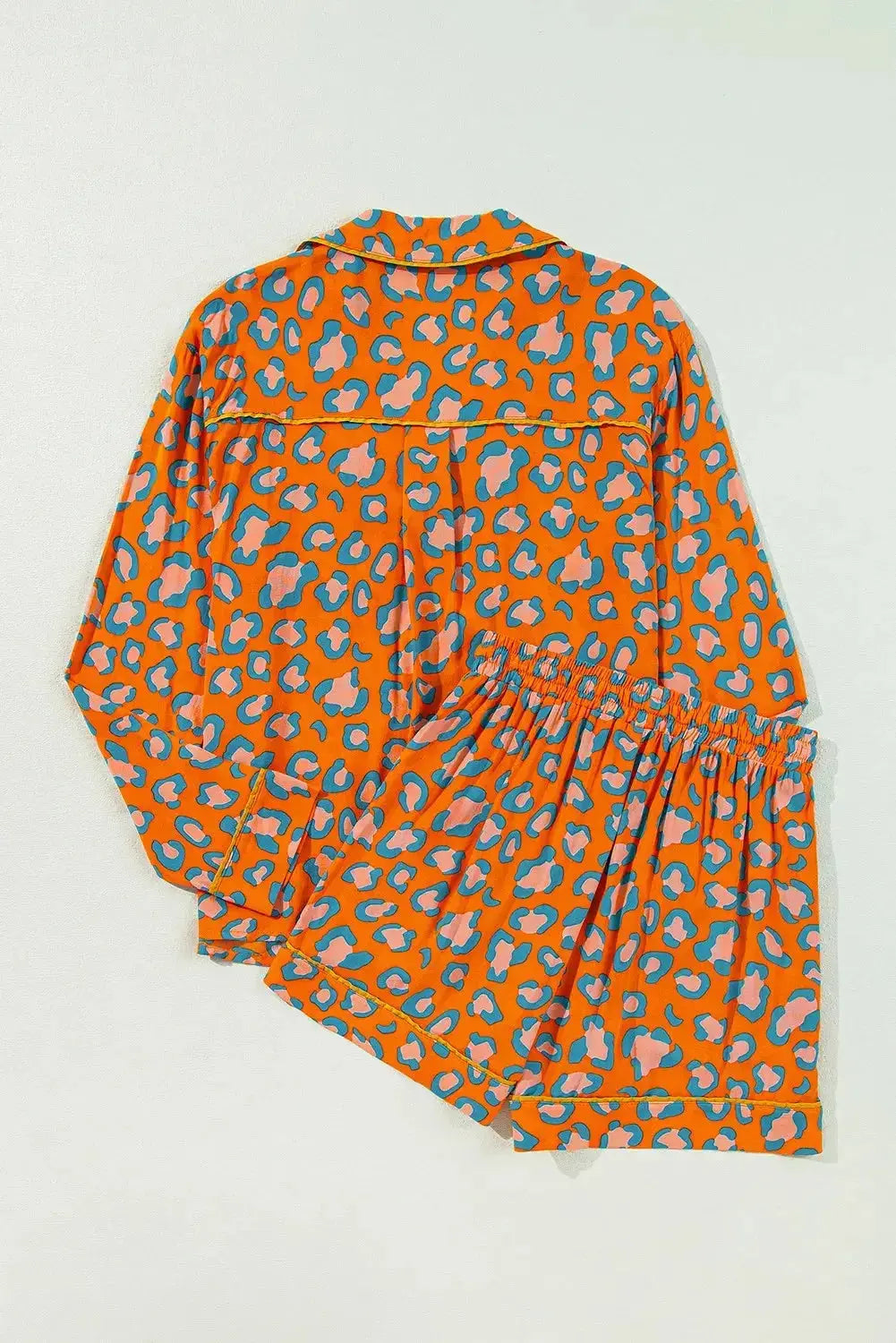 Women’s leopard print pajama set with collared long sleeve top and shorts from Plush Fashion Hub, perfect for comfortable lounging.