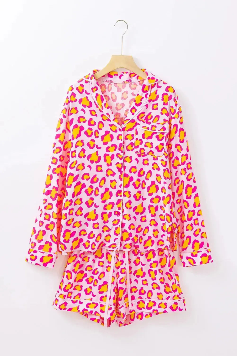 Women’s leopard print pajama set with collared long sleeve top and shorts from Plush Fashion Hub, perfect for lounging.