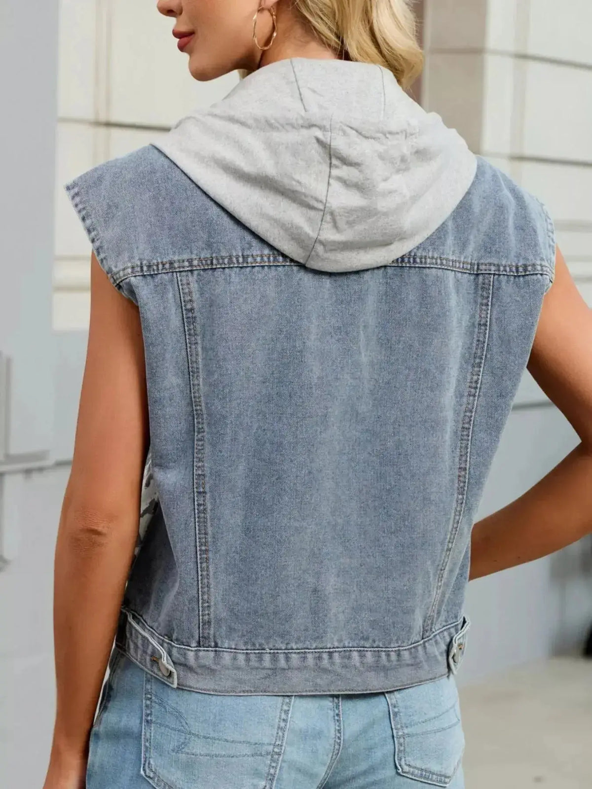 Women’s leopard print hooded denim vest by Plush Fashion Hub, sleeveless button-down jean jacket with stylish leopard pattern.
