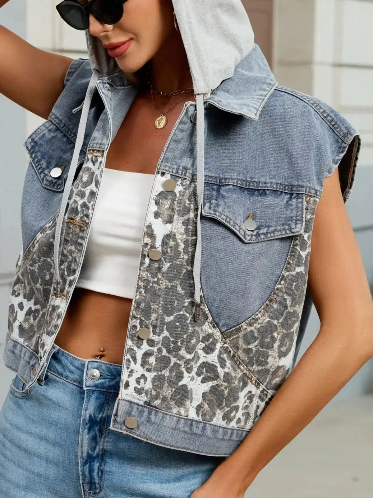 Women’s leopard print denim vest by Plush Fashion Hub featuring a hood, sleeveless design, button-down front, and trendy style.