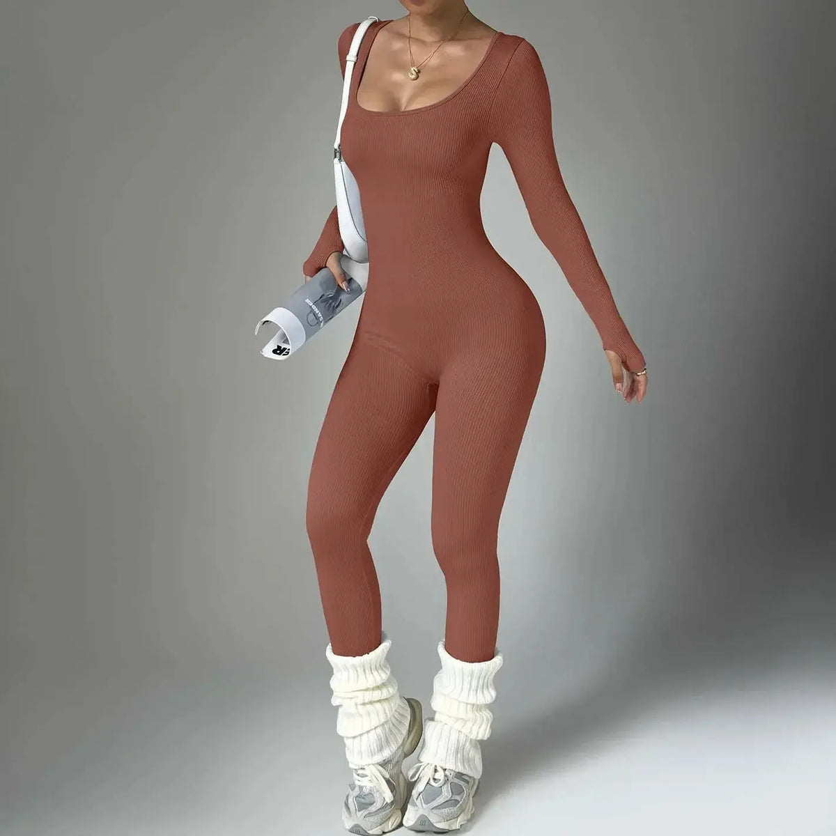 Women wearing Plush Fashion Hub long sleeve compression yoga suit, quick-dry fitness set, ideal for yoga and active workouts.