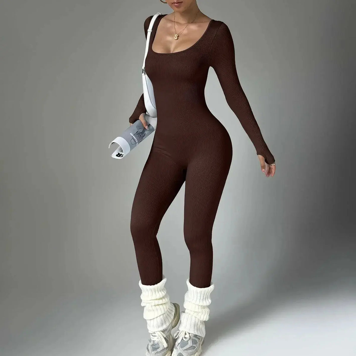 Women wearing a long sleeve compression yoga suit from Plush Fashion Hub, quick-drying fitness clothing for yoga and exercise.