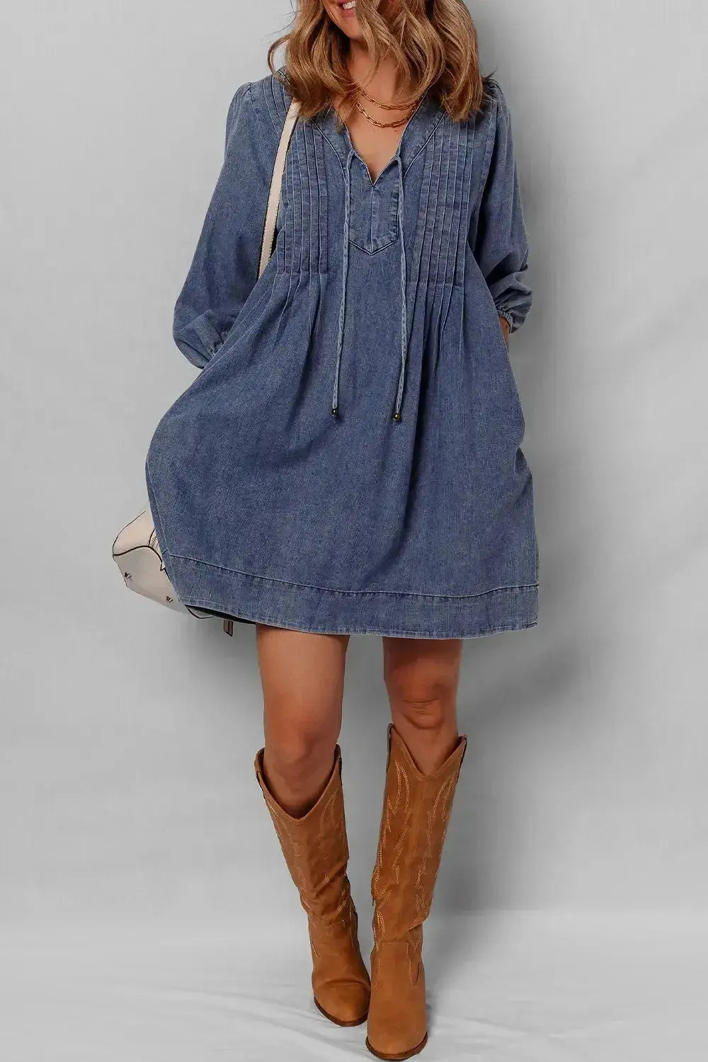 Women's long sleeve denim mini dress with tie neck, soft cotton fabric, casual style by Trendsi.