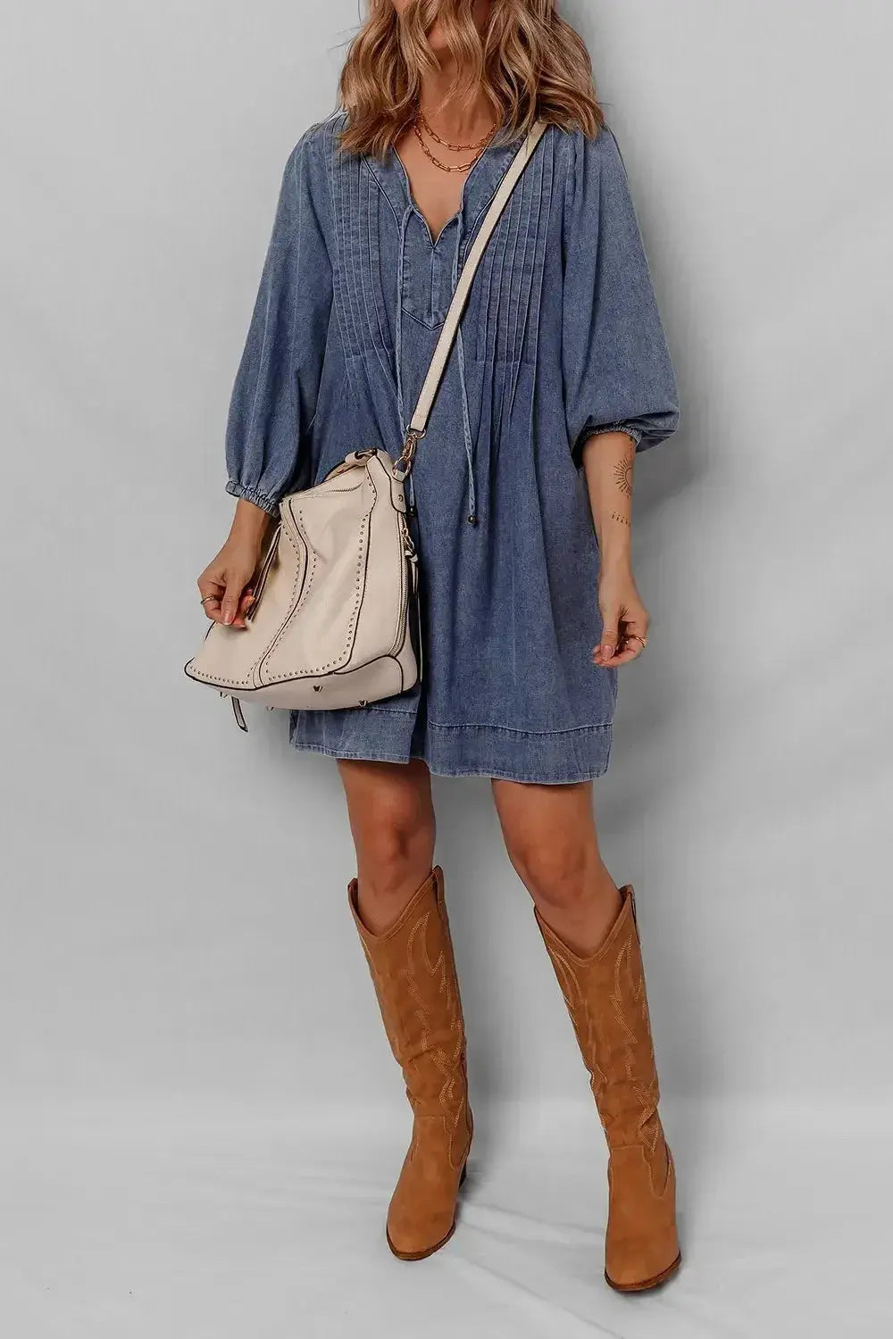 Women's long sleeve tie neck denim mini dress by Trendsi, made of soft cotton, casual style with a fitted silhouette.