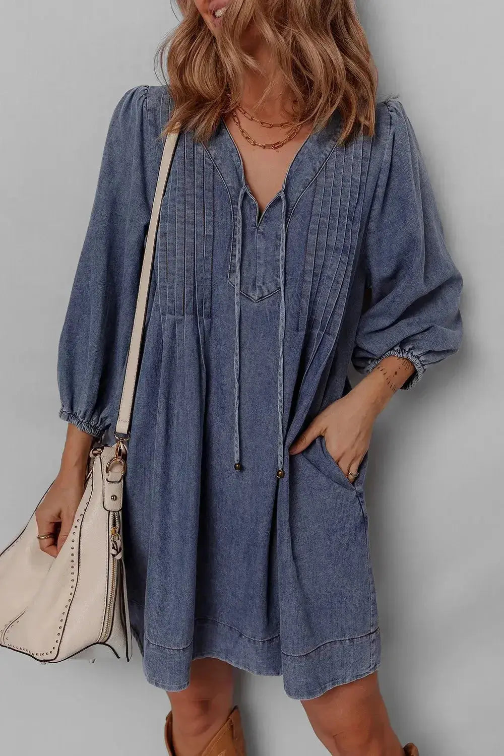 Women’s long sleeve denim mini dress with tie neck, soft cotton fabric, casual style by Plush Fashion Hub.