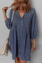 Women's long sleeve denim mini dress with tie neck, soft cotton fabric, casual style, by Trendsi.
