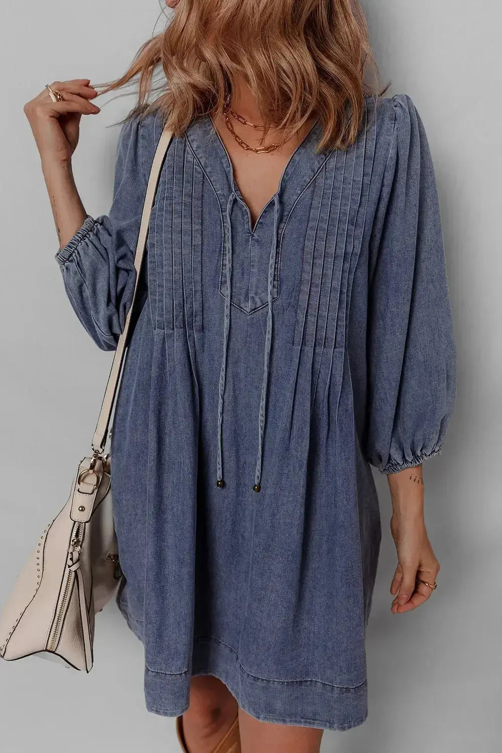Women’s long sleeve tie neck denim mini dress by Plush Fashion Hub featuring soft cotton fabric and casual style.