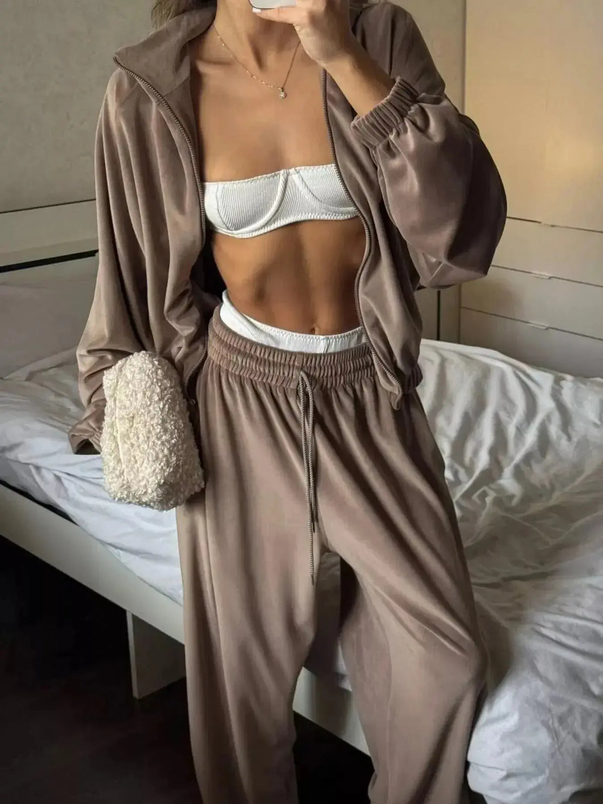 Women’s long sleeve zip-up jacket and matching pants lounge set by Plush Fashion Hub, comfortable and stylish for casual wear.