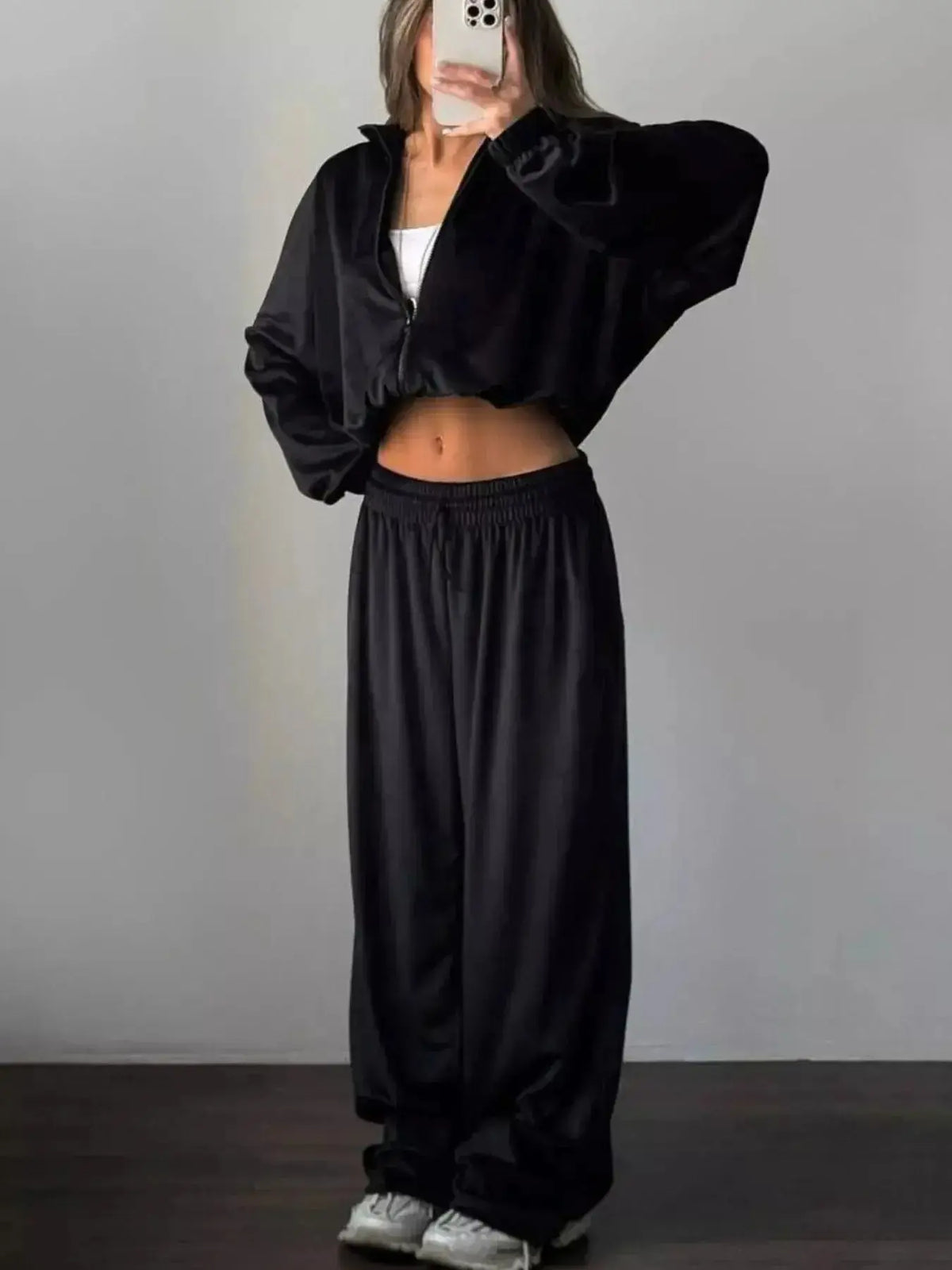 Women’s long sleeve zip-up jacket and matching pants lounge set by Plush Fashion Hub, shown in a comfortable, stylish fit.