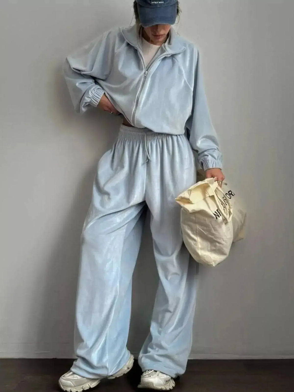 Women’s long sleeve zip-up jacket and matching pants lounge set by Plush Fashion Hub, casual and comfortable for relaxed wear.