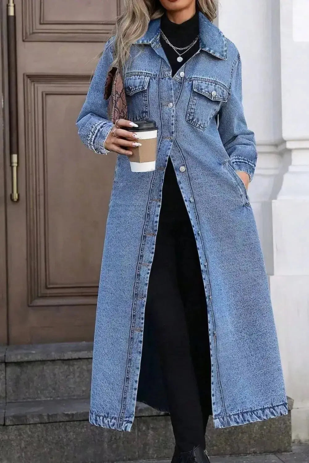 Women's longline denim jacket with button-front closure, structured cotton blend outerwear by Trendsi, casual and stylish.