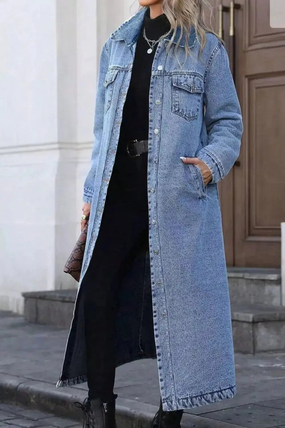 Women's longline denim jacket with button-front closure, structured cotton blend outerwear, casual and stylish by Trendsi.
