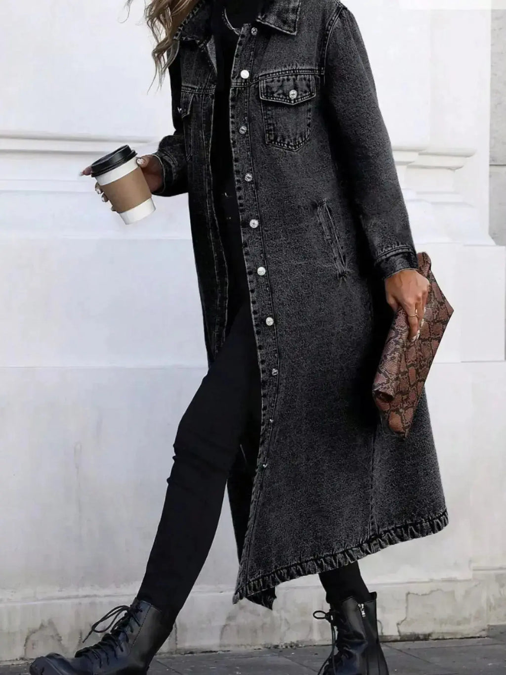 Women's longline denim jacket with button-front closure, structured cotton blend outerwear by Trendsi.