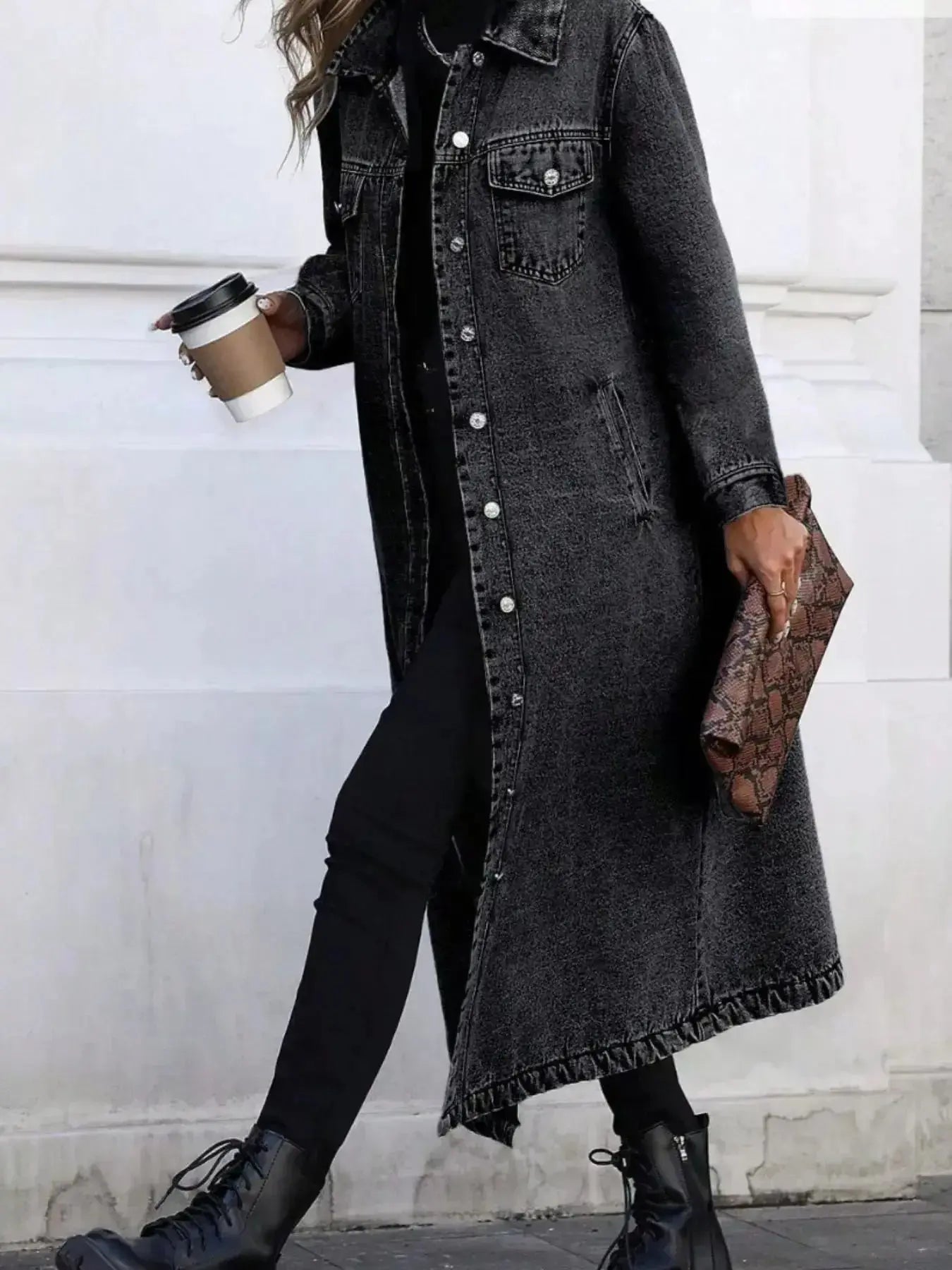 Women's longline denim jacket with button-front closure, structured cotton blend outerwear by Trendsi.