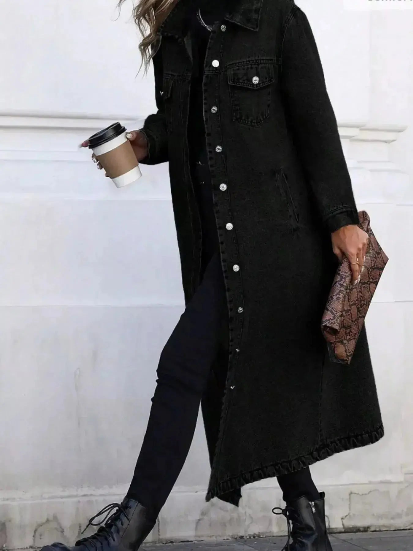 Women's longline denim jacket with button-front closure and structured cotton blend outerwear, featuring classic denim style.