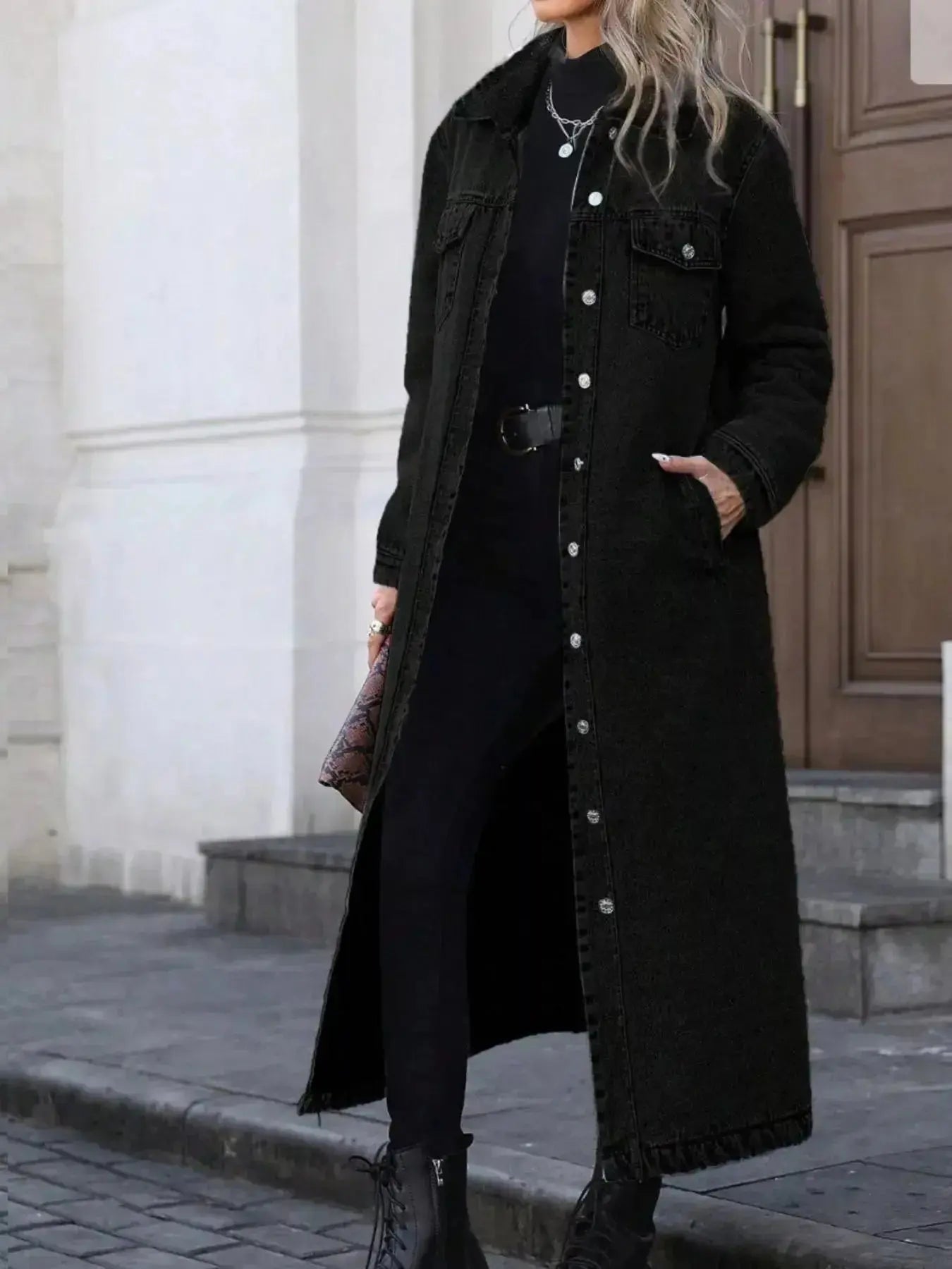 Women's longline denim jacket with button-front closure, structured cotton blend outerwear, detailed by Trendsi.