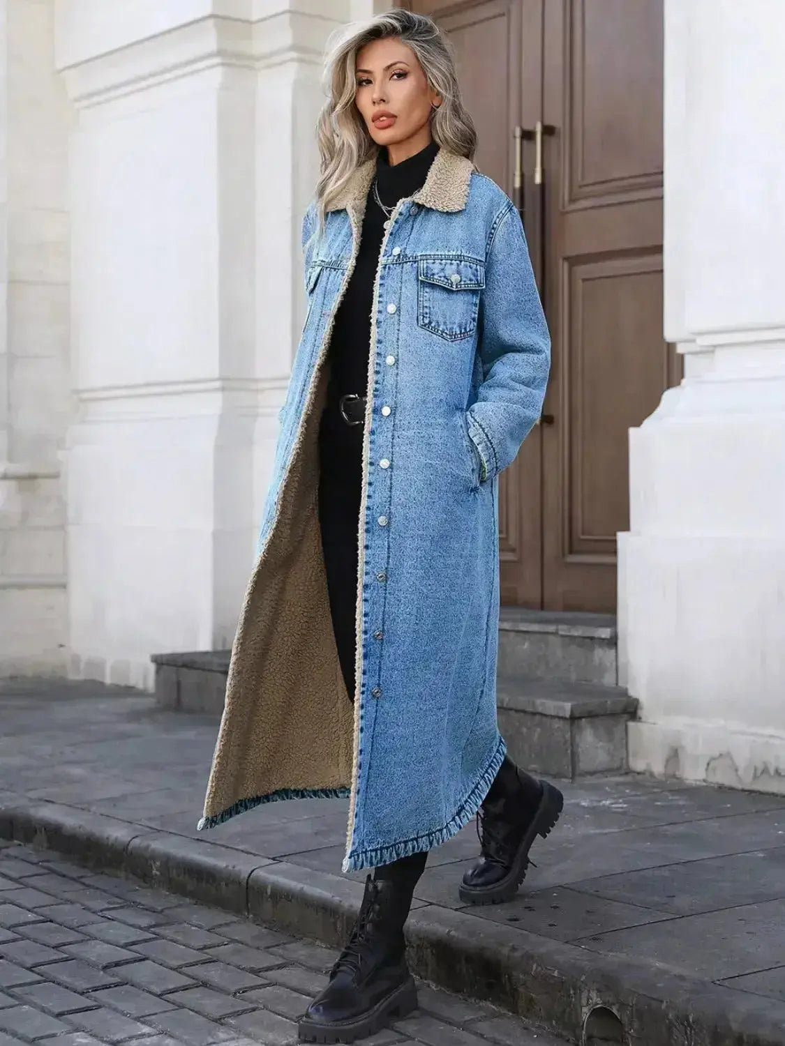 Women's longline denim jacket with cozy sherpa lining, stylish fall and winter outerwear by Plush Fashion Hub.