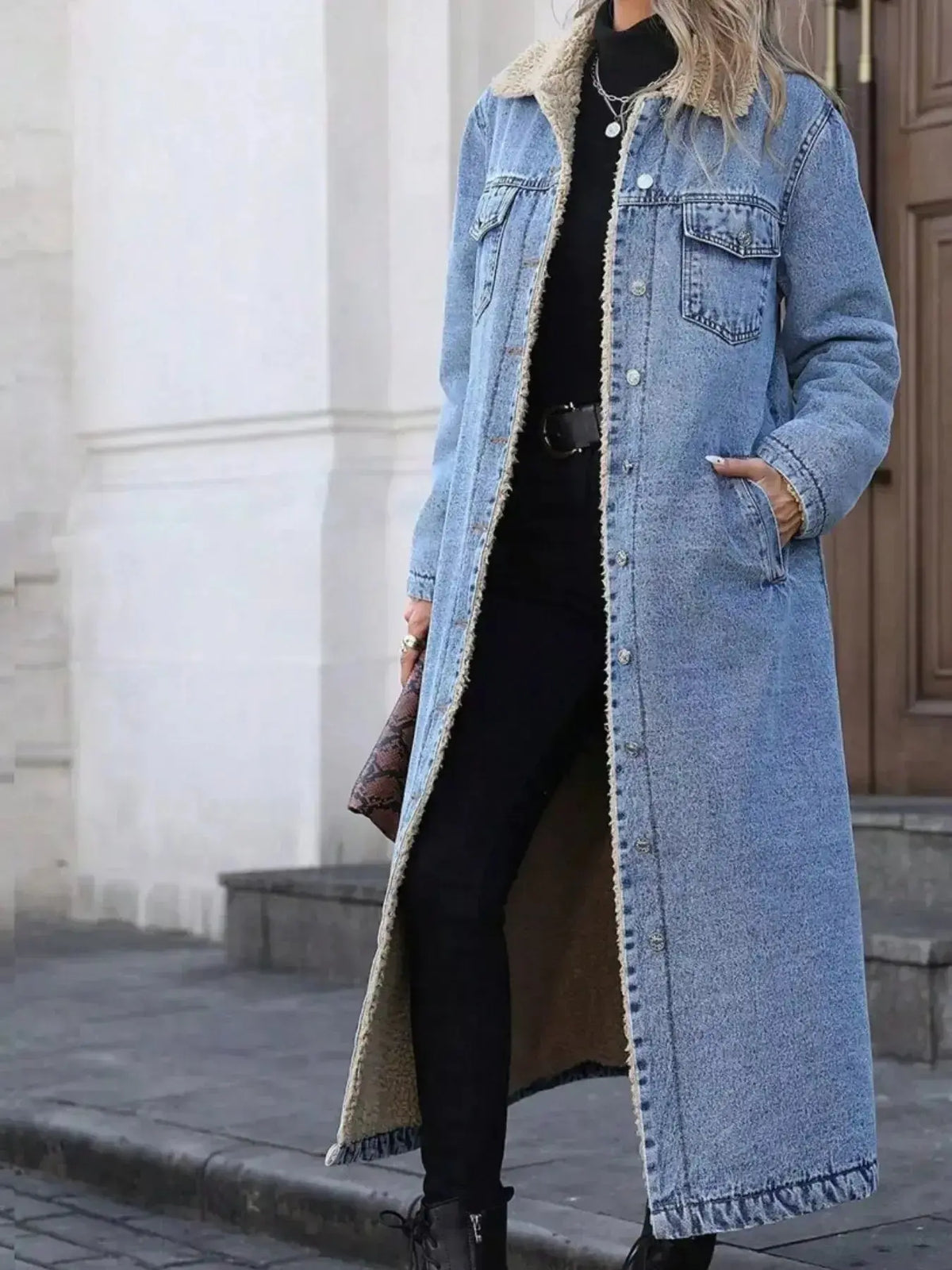 Women’s longline denim jacket with plush sherpa lining, cozy fall and winter outerwear by Plush Fashion Hub.