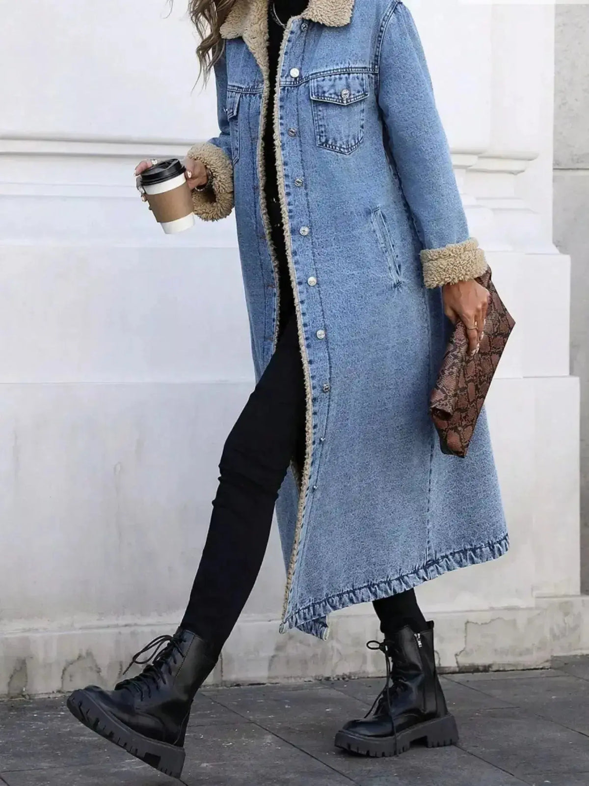 Women’s longline denim jacket by Plush Fashion Hub with cozy sherpa lining, perfect for fall and winter outdoor wear.