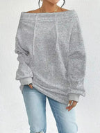 Women’s off-shoulder long sleeve drawstring sweatshirt by Trendsi, featuring plush fabric and a relaxed fit for casual comfort.