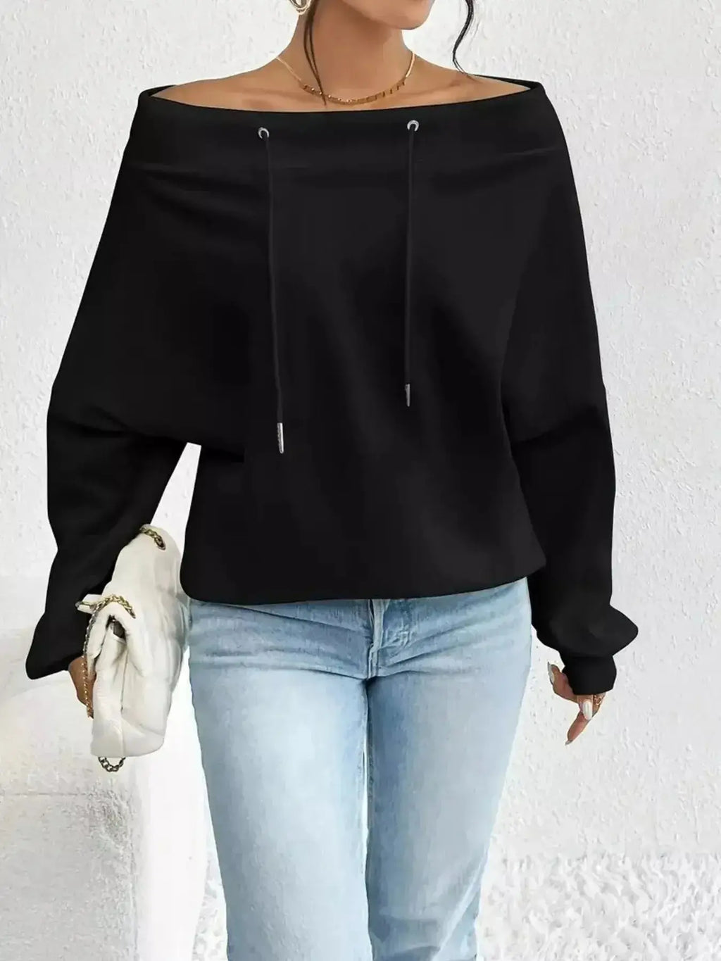 Women’s off-shoulder long sleeve sweatshirt with drawstring details, made by Trendsi, featuring a plush, cozy fabric for casual wear.