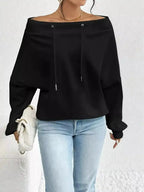 Women’s off-shoulder long sleeve sweatshirt with drawstring details, made by Trendsi, featuring a plush, cozy fabric for casual wear.