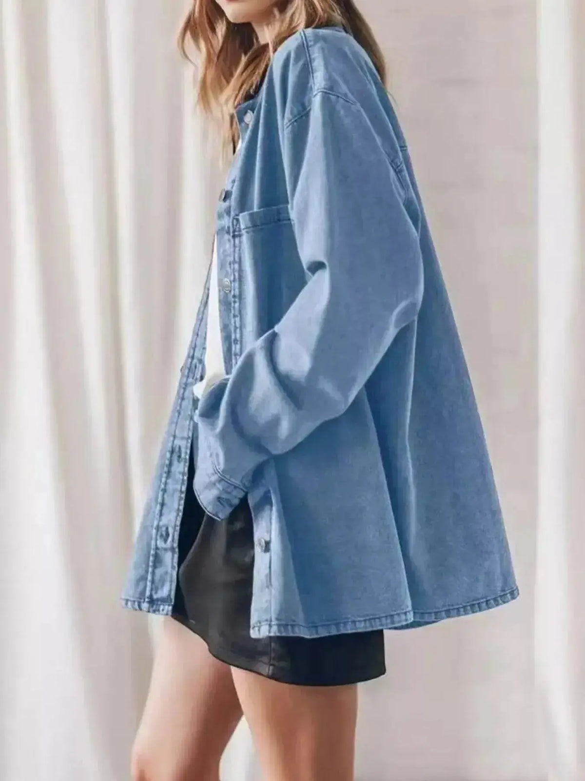 Women wearing a plush fashion hub oversized denim button-up shirt with relaxed fit, casual style, and classic denim look.