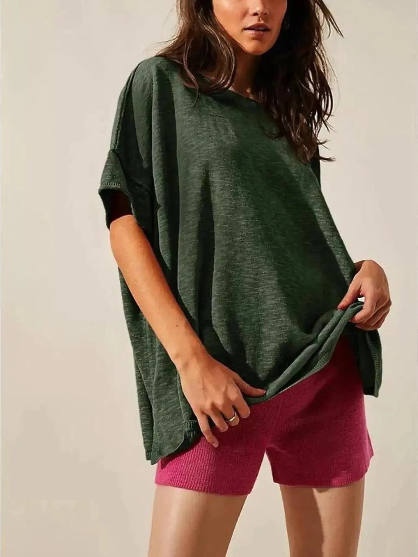 Women’s oversized drop-shoulder round neck T-shirt by Trendsi, relaxed casual fit, soft fabric, worn as everyday casual wear.