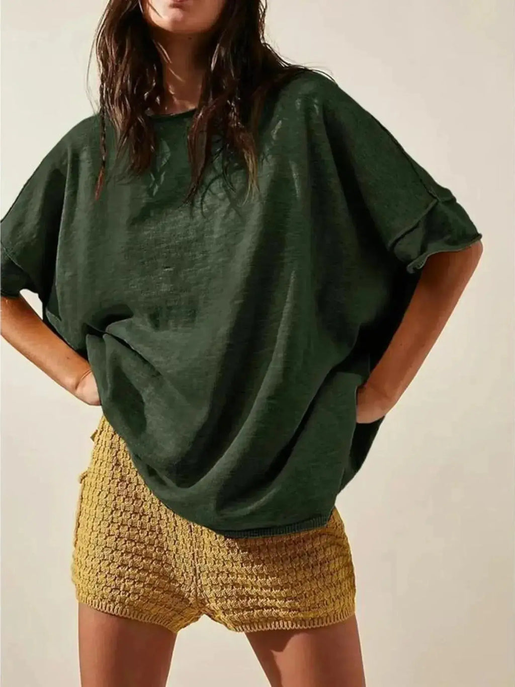 Women’s oversized drop-shoulder round neck T-shirt by Trendsi, relaxed casual fit, soft fabric, and stylish design.