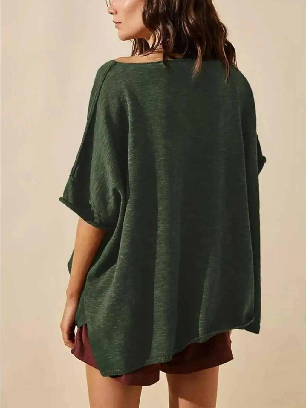 Women's oversized drop-shoulder round neck T-shirt by Trendsi, relaxed casual fit, soft fabric, and stylish design.