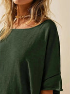 Women's oversized drop-shoulder round neck T-shirt by Trendsi, relaxed casual fit, soft fabric, and stylish loose silhouette.
